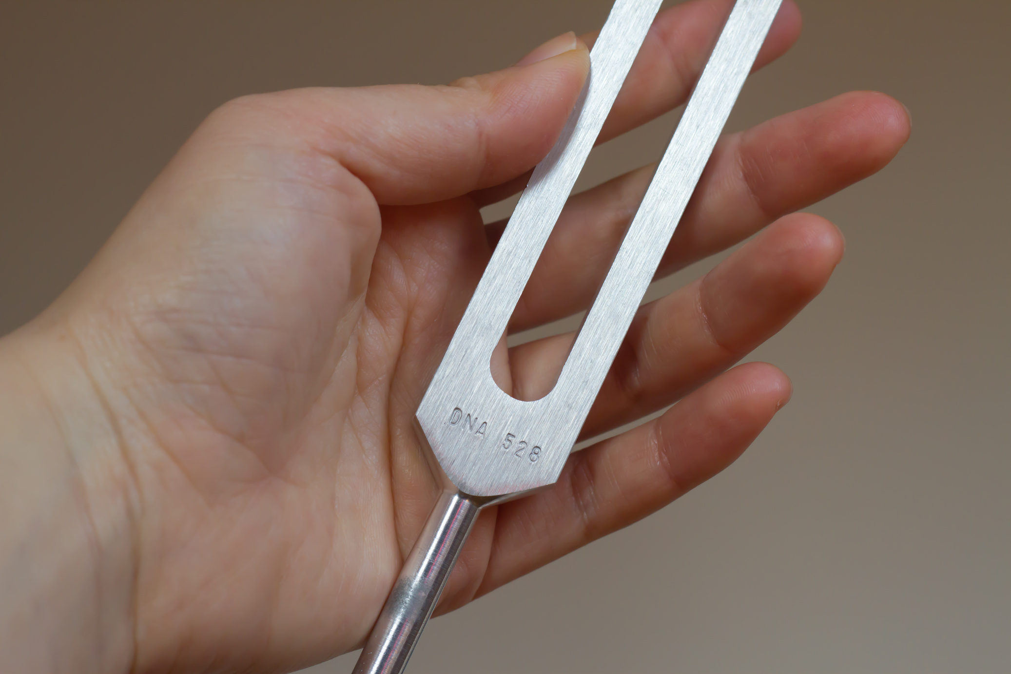 tuning fork and crystal on table .