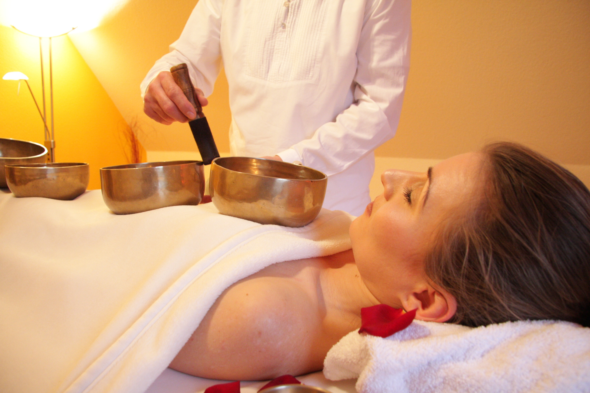 Woman Having a Singing Bowl Massage